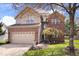 Charming two-story home features brick and siding, a two-car garage, and a well-maintained front lawn at 5343 Ripplingbrook Way, Carmel, IN 46033
