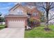 Charming two-story home features brick and siding, a two-car garage, and a well-maintained front lawn at 5343 Ripplingbrook Way, Carmel, IN 46033