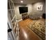 Cozy bonus room with wood floors, a large beanbag chair and a mounted tv at 5373 Ashby Ct, Greenwood, IN 46143