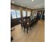 Elegant dining room showcases a large table, natural light, and views of the surrounding neighborhood at 5373 Ashby Ct, Greenwood, IN 46143