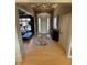 Elegant foyer features gleaming hardwood floors, chandelier, and grand entrance to adjacent living spaces at 5373 Ashby Ct, Greenwood, IN 46143
