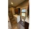 Functional laundry room featuring washer, dryer, and cabinetry with countertop space at 5373 Ashby Ct, Greenwood, IN 46143