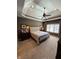 Spacious main bedroom featuring tray ceiling, large window, and carpeting at 5373 Ashby Ct, Greenwood, IN 46143