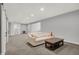 Comfortable basement with neutral carpet, recessed lighting, a sofa, and a coffee table at 5492 Cottage Grove Ln, Noblesville, IN 46062