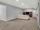 Spacious basement featuring neutral carpet, comfortable seating, and gray painted walls at 5492 Cottage Grove Ln, Noblesville, IN 46062