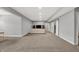 Spacious basement area with gray walls, recessed lighting, carpet, and entertainment area at 5492 Cottage Grove Ln, Noblesville, IN 46062