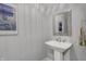 Powder room with pedestal sink and decorative mirror at 5492 Cottage Grove Ln, Noblesville, IN 46062