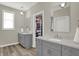 Bright bathroom with double vanity and closet at 5492 Cottage Grove Ln, Noblesville, IN 46062