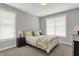 Comfortable bedroom with neutral tones, plush bedding, and ample natural light from large windows at 5492 Cottage Grove Ln, Noblesville, IN 46062