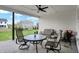 Cozy covered patio with comfortable seating and a ceiling fan, perfect for enjoying the outdoors at 5492 Cottage Grove Ln, Noblesville, IN 46062
