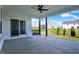 Inviting covered patio providing an outdoor living space with a slider to the interior and backyard view at 5492 Cottage Grove Ln, Noblesville, IN 46062