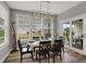 Bright dining room with large windows and a stylish light fixture at 5492 Cottage Grove Ln, Noblesville, IN 46062