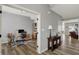 Home office featuring wood floors, gray walls, a modern desk, and custom shelving at 5492 Cottage Grove Ln, Noblesville, IN 46062