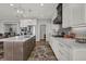 Bright kitchen features a large island, stainless steel appliances, and modern finishes at 5492 Cottage Grove Ln, Noblesville, IN 46062