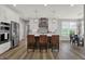 Bright and open kitchen featuring a center island with seating and stainless steel appliances at 5492 Cottage Grove Ln, Noblesville, IN 46062