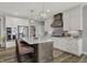 Contemporary kitchen features a large island, modern lighting, and stainless steel appliances at 5492 Cottage Grove Ln, Noblesville, IN 46062