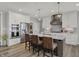 Modern kitchen with white cabinets, stainless steel appliances, and spacious center island with seating at 5492 Cottage Grove Ln, Noblesville, IN 46062