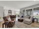 Open concept living room with comfortable seating and access to a stylish kitchen and dining area at 5492 Cottage Grove Ln, Noblesville, IN 46062