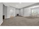 Expansive living room with neutral carpet, natural light, and an open floor plan at 5492 Cottage Grove Ln, Noblesville, IN 46062