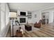 Inviting living room with fireplace, built-in shelving, comfortable seating, and stylish decor at 5492 Cottage Grove Ln, Noblesville, IN 46062