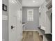 Mudroom featuring storage, seating, and a window at 5492 Cottage Grove Ln, Noblesville, IN 46062