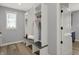 A mudroom with built-in bench, coat rack, and storage cubbies at 5492 Cottage Grove Ln, Noblesville, IN 46062