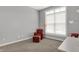 Bright and airy office space featuring a comfortable chair and ottoman with a window view at 5492 Cottage Grove Ln, Noblesville, IN 46062