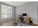 Bright office space featuring modern desk, ergonomic chair, and large window with natural light at 5492 Cottage Grove Ln, Noblesville, IN 46062
