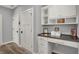 Bright office nook featuring white cabinetry, a dark desktop, and natural light at 5492 Cottage Grove Ln, Noblesville, IN 46062