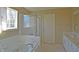 Bright bathroom featuring a separate tub and shower, with white cabinetry at 5639 Aquamarine Dr, Carmel, IN 46033