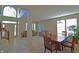 Inviting foyer featuring high ceilings, tile flooring, staircase, and open access to living and dining areas at 5639 Aquamarine Dr, Carmel, IN 46033