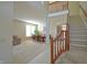 Open-concept living space featuring a staircase, dining area, and a comfortable seating area at 5639 Aquamarine Dr, Carmel, IN 46033