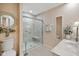 Bathroom showing tiled walk in shower, toilet, and vanity at 5766 Kensington S Way, Plainfield, IN 46168