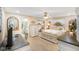 Bedroom with carpet flooring, ceiling fan, mirrored closet, and open bathroom at 5766 Kensington S Way, Plainfield, IN 46168
