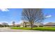 An eye-level shot of a beautiful, well-maintained lawn and brick home in the suburbs at 5766 Kensington S Way, Plainfield, IN 46168
