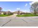 Attractive single-story brick home featuring a well-kept lawn and a two-car garage at 5766 Kensington S Way, Plainfield, IN 46168