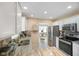 Well-equipped kitchen features granite countertops, stainless steel appliances, and functional design at 5766 Kensington S Way, Plainfield, IN 46168
