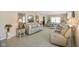 Bright and airy living room featuring plush neutral-toned furniture and elegant decor at 5766 Kensington S Way, Plainfield, IN 46168