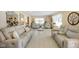 Spacious living room with neutral furniture, elegant decor, and lots of natural light at 5766 Kensington S Way, Plainfield, IN 46168