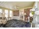 Enclosed sunroom with carpet flooring, ceiling fan, and white trim at 5766 Kensington S Way, Plainfield, IN 46168