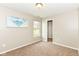 Bedroom with carpet, a window, artwork, and a view of a walk-in closet at 5856 Long Ridge Pl, Indianapolis, IN 46221
