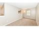 Hallway area featuring neutral walls, carpet, a window, and an art piece at 5856 Long Ridge Pl, Indianapolis, IN 46221