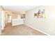Spacious upstairs hallway featuring neutral walls, carpet, and views into other rooms at 5856 Long Ridge Pl, Indianapolis, IN 46221