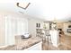 Open kitchen with breakfast bar, stylish stools, and seamless flow to living space at 5856 Long Ridge Pl, Indianapolis, IN 46221