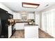 Charming kitchen with island, modern appliances, and ample cabinet space at 5856 Long Ridge Pl, Indianapolis, IN 46221