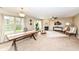 Inviting living room featuring a cozy fireplace, neutral walls, and plenty of natural light at 5856 Long Ridge Pl, Indianapolis, IN 46221