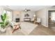 Cozy living room featuring a fireplace, mantel, comfortable seating, and carpet flooring at 5856 Long Ridge Pl, Indianapolis, IN 46221