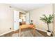 Cozy office space featuring a desk, neutral walls, and double doors leading into another room at 5856 Long Ridge Pl, Indianapolis, IN 46221