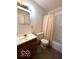 Bathroom with toilet, sink and shower with curtain at 5868 Hillside Ave, Indianapolis, IN 46220