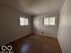 A bedroom with two windows at 5868 Hillside Ave, Indianapolis, IN 46220